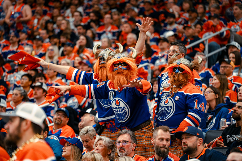 Photo of Oilers fans dressed up as vikings, sitting in the stands of an Oilers Playoff game