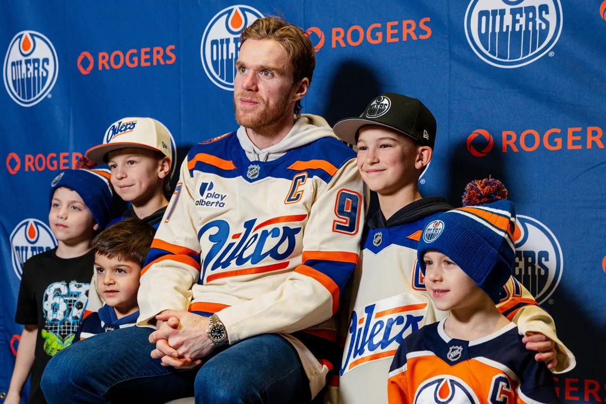 Photo of Connor McDavid with Season Seat Holders on Photo Day