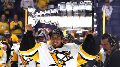 MAF lifting cup with Penguins