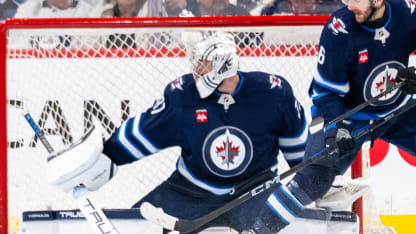 Hellebuyck keeps the puck out