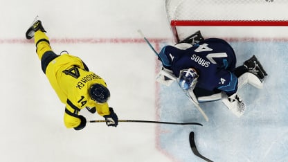 Juuse Saros #74 of Team Finland defends the net against Joel Eriksson Ek #14 of Team Sweden in the third period during the Men's Preliminary Group B match between Finland and Sweden on day seven of the Milano Cortina 2026 Winter Olympic games at Milano Santagiulia Ice Hockey Arena on February 13, 2026 in Milan, Italy. (Photo by Gregory Shamus/Getty Images)