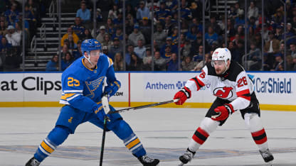 Logan Mailloux #23 of the St. Louis Blues controls the puck as Timo Meier #28 of the New Jersey Devils pressures on February 28, 2026 at the Enterprise Center in St. Louis, Missouri. (Photo by Scott Rovak/NHLI via Getty Images)