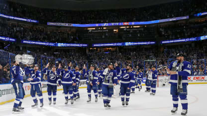 Steven Stamkos #91 of the Tampa Bay Lightning hands off the Stanley Cup to Victor Hedman #77 following the victory over the Montreal Canadiens in Game Five of the 2021 NHL Stanley Cup Final at the Amalie Arena on July 07, 2021 in Tampa, Florida. The Lightning defeated the Canadiens 1-0 to take the series four games to one. (Photo by Bruce Bennett/Getty Images)