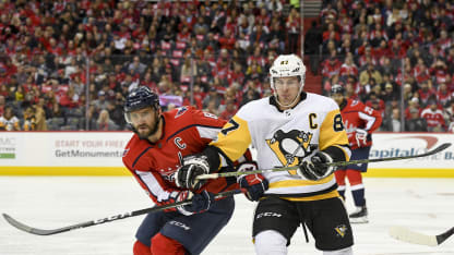 Washington Capitals left wing Alex Ovechkin (8) and Pittsburgh Penguins center Sidney Crosby (87) fight for a second period puck on November 10, 2017, at the Capital One Arena in Washington, D.C. (Photo by Mark Goldman/Icon Sportswire via Getty Images)
