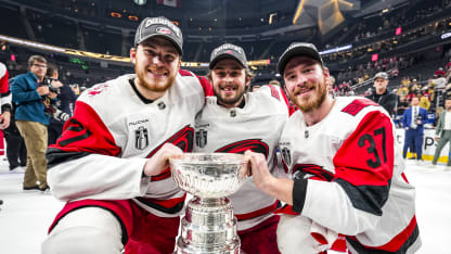 Alexander Nikishin #21, Pyotr Kochetkov #52, and Andrei Svechnikov #37 of the Carolina Hurricanes pose for a picture on the ice with the Stanley Cup after winning the 2026 Stanley Cup Final at T-Mobile Arena on June 14, 2026 in Las Vegas, Nevada. (Photo by Josh Lavallee/NHLI via Getty Images)