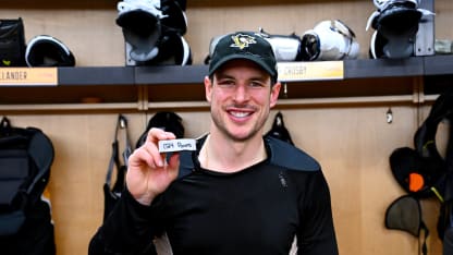 Sidney Crosby #87 of the Pittsburgh Penguins posed with his 1,724 point puck after the game against the Montréal Canadiens at PPG PAINTS Arena on December 21h, 2025 in Pittsburgh, Pennsylvania. (Photo by Joe Sargent/NHLI via Getty Images)