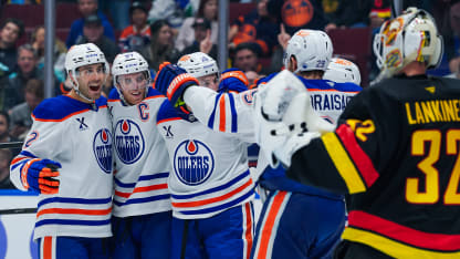 Connor McDavid #97 of the Edmonton Oilers is congratulated after scoring a goal on Kevin Lankinen #32 of the Vancouver Canucks during the third period of their NHL game at Rogers Arena on November 9, 2024 in Vancouver, British Columbia, Canada. (Photo by Derek Cain/Getty Images)