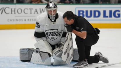 Darcy Kuemper #35 of the Los Angeles Kings gets looked at against the Dallas Stars at the American Airlines Center on December 15, 2025 in Dallas, Texas. (Photo by Glenn James/NHLI via Getty Images)