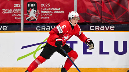 Jamiro Reber #6 of Team Switzerland skates the puck in the second period against Team Slovakia of the Group B match during the 2025 IIHF World Junior Championship at The Arena at TD place on December 27, 2024 in Ottawa, Ontario, Canada. Team Slovakia defeated Team Switzerland 2-1. (Photo by Minas Panagiotakis/Getty Images)