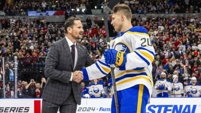 Patrik Elias shakes hands with Jiri Kulich #20 of the Buffalo Sabres