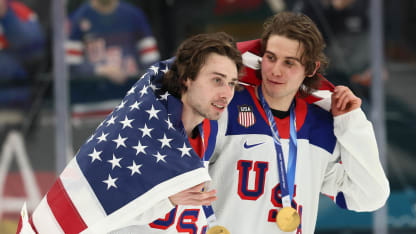 Gold medalists Quinn Hughes #43 and Jack Hughes #86 of Team United States celebrates after the medal ceremony for Men's Ice Hockey following the Men's Gold Medal match between Canada and the United States on day 16 of the Milano Cortina 2026 Winter Olympic games at Milano Santagiulia Ice Hockey Arena on February 22, 2026 in Milan, Italy. (Photo by Bruce Bennett/Getty Images)