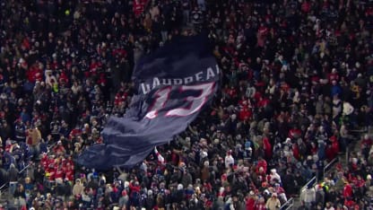 Fans pass around Gaudreau banner