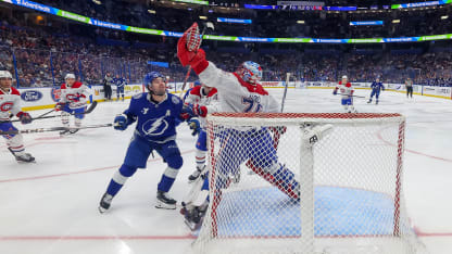 Jakub Dobes #75 of the Montréal Canadiens grabs a high puck in front of Brandon Hagel #38 of the Tampa Bay Lightning during the first period at the Benchmark International Arena on March 31, 2026 in Tampa, Florida. (Photo by Mike Carlson/Getty Images)
