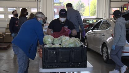 Firefighter and Volunteer Packing Produce