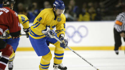 Mikael Renberg #19 of Sweden skates down the ice with the puck during the Salt Lake City Winter Olympic Games at the E Center in Salt Lake City, Utah. DIGITAL IMAGE. Mandatory Credit: Brian Bahr/Getty Images