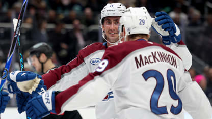 MacKinnon pinballs puck home