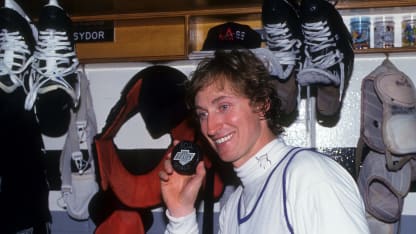 INGLEWOOD, CA - MARCH 23: Wayne Gretzky #99 of the Los Angeles Kings poses with the puck he scored his 802nd career goal with after the game against the Vancouver Canucks on March 23, 1994 at the Great Western Forum in Inglewood, California. Gretzky passed Gordie Howe for most career goals. (Photo by B Bennett/Getty Images)