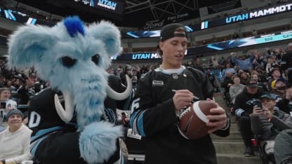 Jaxson Dart tosses footballs to the crowd