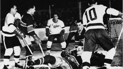 A scramble in front of the net during a game between the Detroit Red Wings and the Montreal Canadiens, mid 1950s. Players are, from left Red Wing Gordie Howe, Canadien Floyd Curry, Red Wing Ted Lindsay, and unidentified Canadien lying on the ice and goalkeeper Jacques Plante, and Red Wing Alex Delvecchio (#10). (Photo by Bruce Bennett Studios via Getty Images Studios/Getty Images)