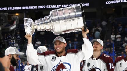 Andre Burakovsky #95 of the Colorado Avalanche carries the Stanley Cup following the series winning victory over the Tampa Bay Lightning in Game Six of the 2022 NHL Stanley Cup Final at Amalie Arena on June 26, 2022 in Tampa, Florida. (Photo by Bruce Bennett/Getty Images)