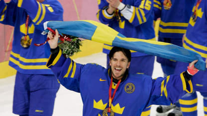 Henrik Lundqvist #35 of Sweden waves the Swedish flag after Sweden defeated Finland 3-2 to win the gold medal during the final of the men's ice hockey match between Finland and Sweden during Day 16 of the Turin 2006 Winter Olympic Games on February 26, 2006 at the Palasport Olimpico in Turin, Italy. (Photo by Brian Bahr/Getty Images)