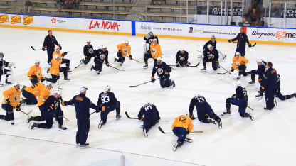 The team stretches during Sabres training camp at HarborCenter