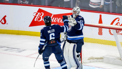 Colin Miller #6 and goaltender Connor Hellebuyck #37 of the Winnipeg Jets celebrate a 6-3 victory over the Florida Panthers at the Canada Life Centre on November 19, 2024 in Winnipeg, Manitoba, Canada. (Photo by Jonathan Kozub/NHLI via Getty Images)