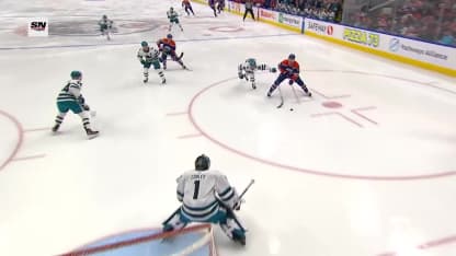 McDavid's pass deflects in