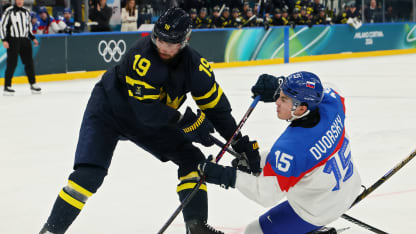Dalibor Dvorsky #15 of Team Slovakia and Adrian Kempe #19 of Team Sweden compete for the puck in the second period during the Men's Preliminary Group B match between Sweden and Slovakia on day eight of the Milano Cortina 2026 Winter Olympic games at Milano Santagiulia Ice Hockey Arena on February 14, 2026 in Milan, Italy. (Photo by Bruce Bennett/Getty Images)