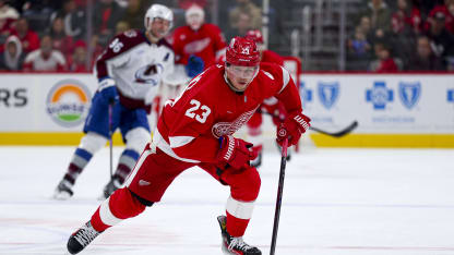Lucas Raymond #23 of the Detroit Red Wings skates the puck up the ice during the second period of a game against the Colorado Avalanche at Little Caesars Arena on December 07, 2024 in Detroit, Michigan. (Photo by Mike Mulholland/Getty Images)