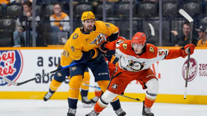 NASHVILLE, TENNESSEE - OCTOBER 21: Filip Forsberg #9 of the Nashville Predators battles for the puck against Olen Zellweger #51 of the Anaheim Ducks during an NHL game at Bridgestone Arena on October 21, 2025 in Nashville, Tennessee. (Photo by John Russell/NHLI via Getty Images)
