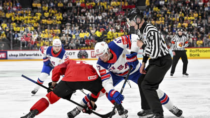 Andres Ambuhl of Switzerland and Michael Mccarron of United States battle on a faceoff during the 2025 Ice Hockey World Championship gold medal dispute match between Switzerland and USA at Avicii Arena on May 25, 2025 in Stockholm, Sweden. (Photo by Andrea Branca/Just Pictures/Sipa USA)(Sipa via AP Images)