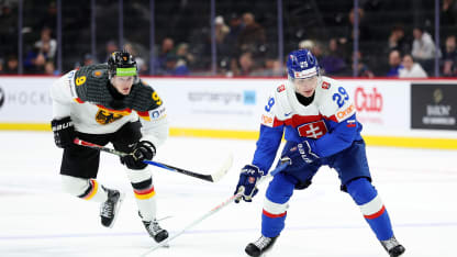Tomas Chrenko #29 of Slovakia skates with the puck past Elias Pul #9 of Germany in the third period at Grand Casino Arena on December 27, 2025 in St Paul, Minnesota. Slovakia defeated Germany 4-1. (Photo by David Berding/Getty Images)