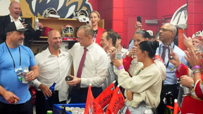 Head Coach Paul Maurice of the Florida Panthers gives the final puck to general manager Bill Zito in the locker room after Game Six of the 2025 Stanley Cup Final between the Edmonton Oilers and the Florida Panthers at Amerant Bank Arena on June 17, 2025 in Sunrise, Florida. The Panthers won the Stanley Cup Final series 4-2. (Photo by Brian Babineau/NHLI via Getty Images)