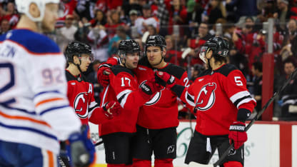 New Jersey Devils defenseman Simon Nemec (17) celebrates with New Jersey Devils left wing Jesper Bratt (63), New Jersey Devils right wing Timo Meier (28), and New Jersey Devils defenseman Brenden Dillon (5) after scoring a goal during a NHL game between the Edmonton Oilers and New Jersey Devils at Prudential Center on March 13, 2025 in Newark, New Jersey. (Photo by Andrew Mordzynski/Icon Sportswire via Getty Images)