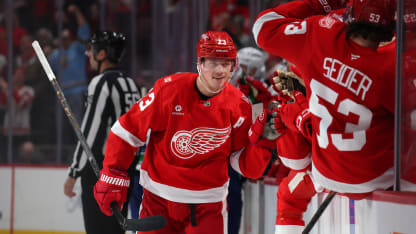 Lucas Raymond #23 of the Detroit Red Wings celebrates his third period goal with teammates while playing the Vancouver Canucks at Little Caesars Arena on January 08, 2026 in Detroit, Michigan. (Photo by Gregory Shamus/Getty Images)