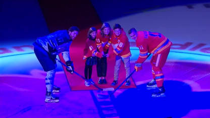 Snow's family drops puck before Flames opener