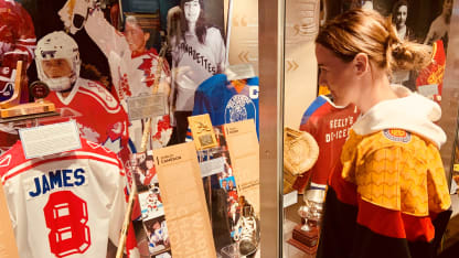 HHOF women’s exhibit pic 2 German player looking at Angela James display