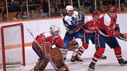 Walt Poddubny #8 of the Toronto Maple Leafs skates against Al Jensen #35, Larry Murphy #8 and Dave Christian #27 of the Washington Capitals during NHL game action on January 29, 1986 at Maple Leaf Gardens in Toronto, Ontario, Canada. (Photo by Graig Abel/Getty Images)