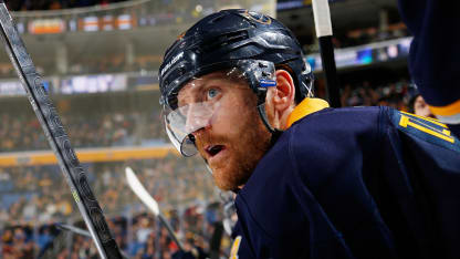 Henrik Tallinder #20 of the Buffalo Sabres watches the action against the Boston Bruins on February 26, 2014 at the First Niagara Center in Buffalo, New York. (Photo by Bill Wippert/NHLI via Getty Images)
