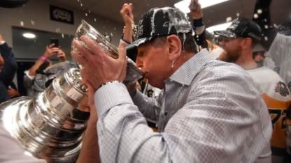 jacques martin drinks from Stanley Cup