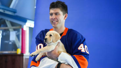 Islanders Take Pictures with Puppies for Pucks and Paws Calendar