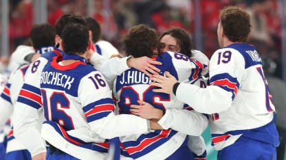 Jack Hughes #86 of Team United States celebrates with teammates after scoring the game-winning goal to win the gold medals in overtime during the Men's Gold Medal match between Canada and the United States on day 16 of the Milano Cortina 2026 Winter Olympic games at Milano Santagiulia Ice Hockey Arena on February 22, 2026 in Milan, Italy. (Photo by Gregory Shamus/Getty Images)
