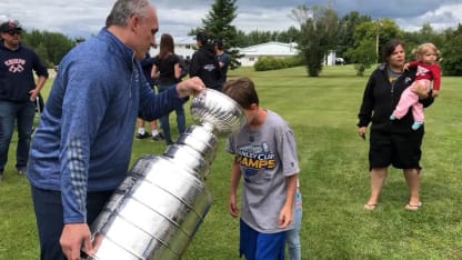 Kids drink OJ from Stanley Cup