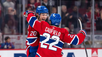 Cole Caufield (22) of the Montreal Canadiens congratulates Juraj Slafkovsky (20)