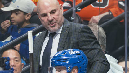 Head coach Rick Tocchet of the Vancouver Canucks talks to Elias Pettersson #40 during their NHL game against the Nashville Predators at Rogers Arena on November 17, 2024 in Vancouver, British Columbia, Canada. (Photo by Jeff Vinnick/NHLI via Getty Images)