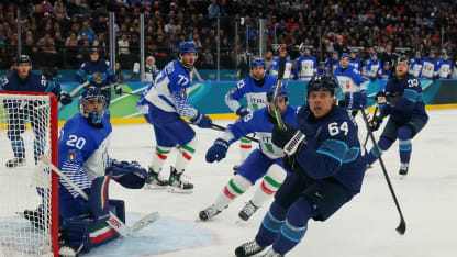 Damian Clara #20 of Team Italy and Mikael Granlund #64 of Team Finland watch a loose puck in the first period during the Men's Preliminary Group B match between Finland and Italy on day eight of the Milano Cortina 2026 Winter Olympic games at Milano Santagiulia Ice Hockey Arena on February 14, 2026 in Milan, Italy. (Photo by Bruce Bennett/Getty Images)