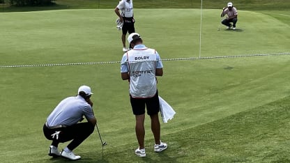 Boldy lining up putt