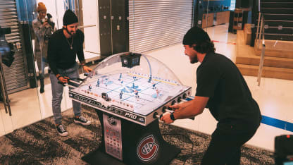 Kings Danault Durzi playing bubble hockey