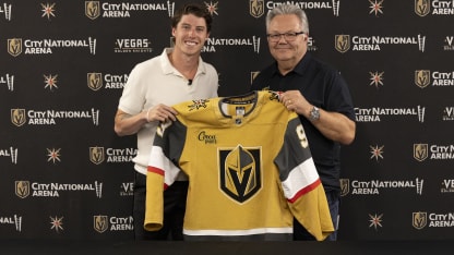 Mitch Marner holds up jersey with Kelly McCrimmon